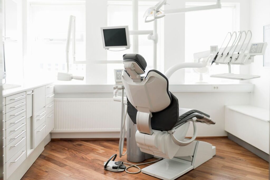 Interior of dental clinic. Empty chair on hardwood floor. It is in brightly lit doctor's office. general dentistry dentist in Flower Mound Texas